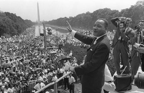 The Rev. Martin Luther King Jr. waved to supporters on the Mall during the 